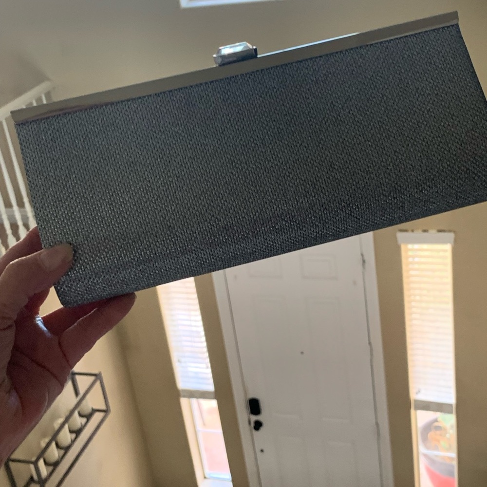 Women’s silver clutch.